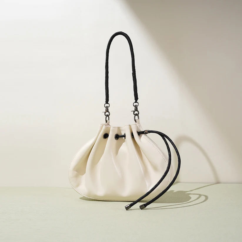 Pleated lambskin bucket bag with a shell-like silhouette