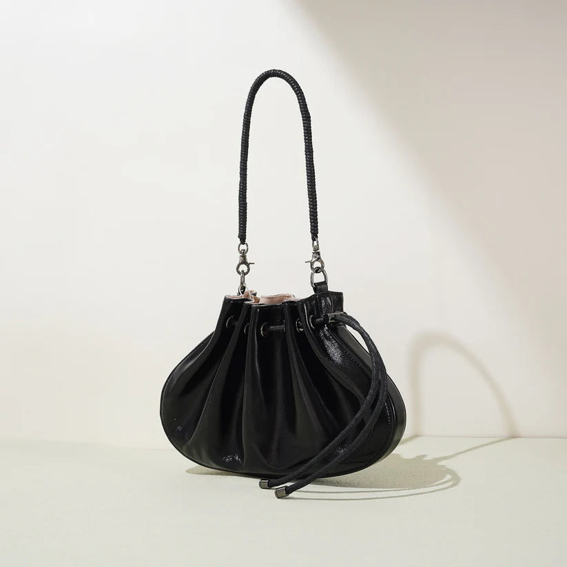 Pleated lambskin bucket bag with a shell-like silhouette