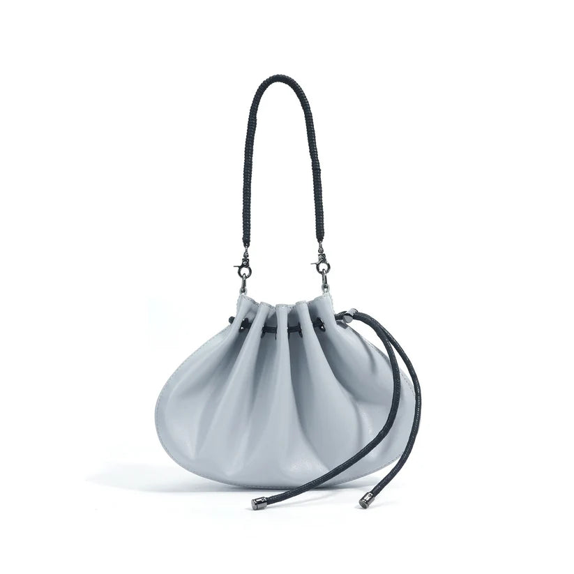 Pleated lambskin bucket bag with a shell-like silhouette