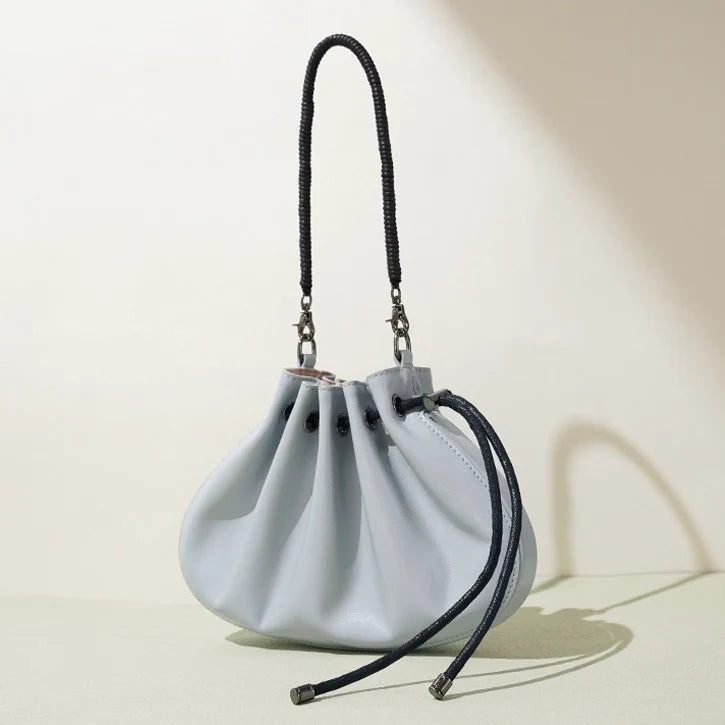 Pleated lambskin bucket bag with a shell-like silhouette