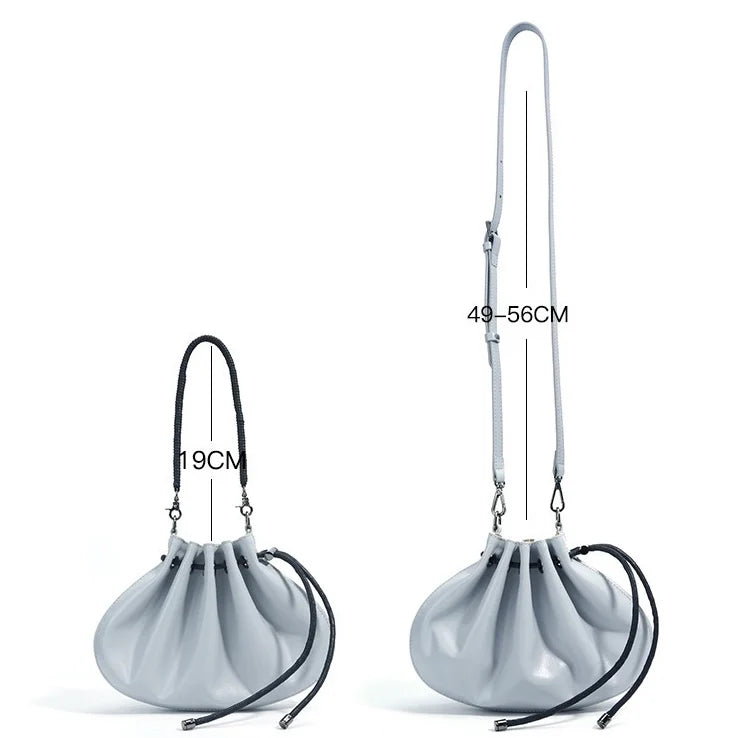 Pleated lambskin bucket bag with a shell-like silhouette