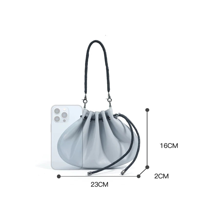 Pleated lambskin bucket bag with a shell-like silhouette